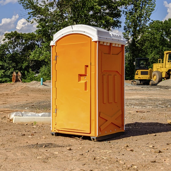 what is the cost difference between standard and deluxe portable restroom rentals in Guild